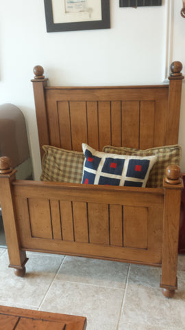 Panelled wood twin bed